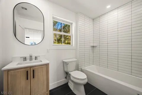 a bathroom with a sink a toilet and a bathtub