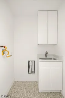 a view of storage and utility room with washer and dryer