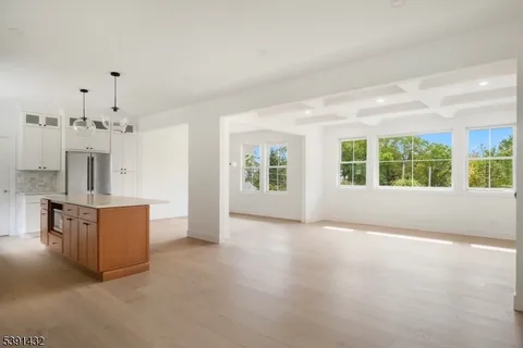 a view of kitchen with furniture and large windows