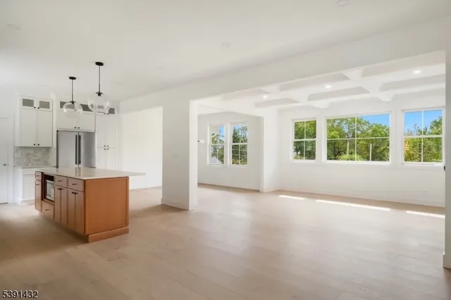 a view of kitchen with furniture and large windows