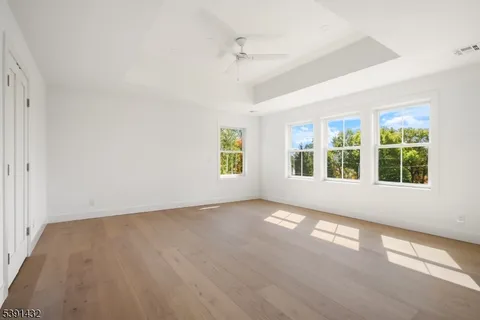 a spacious bedroom with a bed and a couch