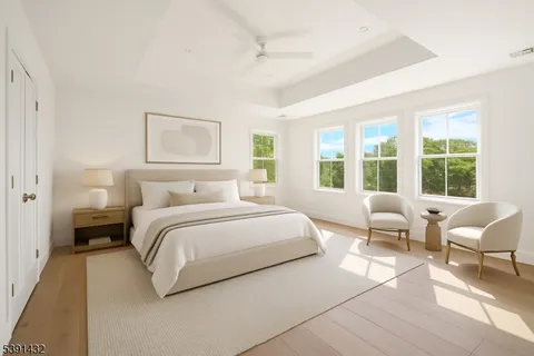 a en suite bathroom with a granite countertop tub double and sink