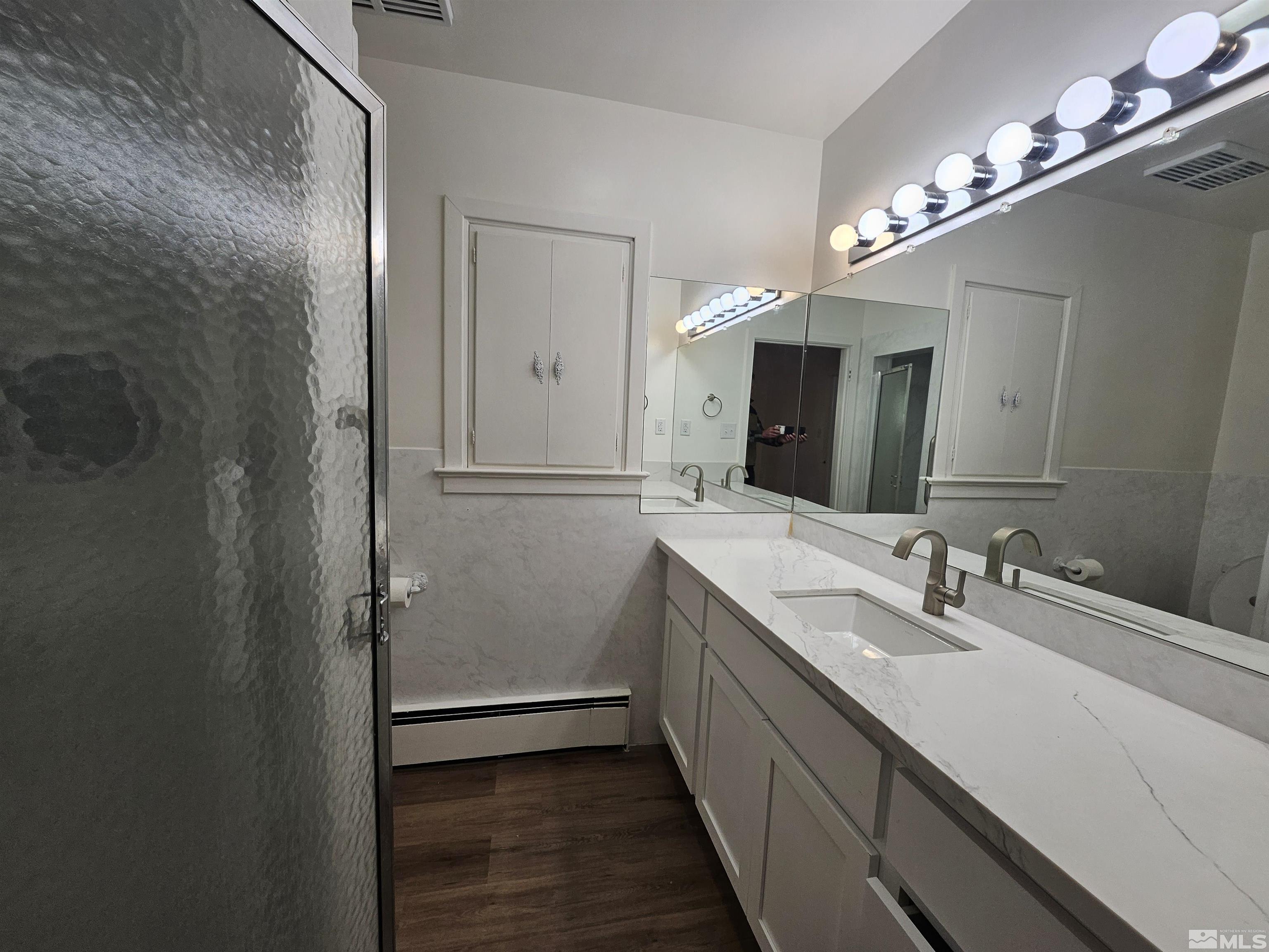 2199 Humboldt Street Reno, NV 89509 - Photo 19 of 35 a bathroom with a double vanity sink and a mirror