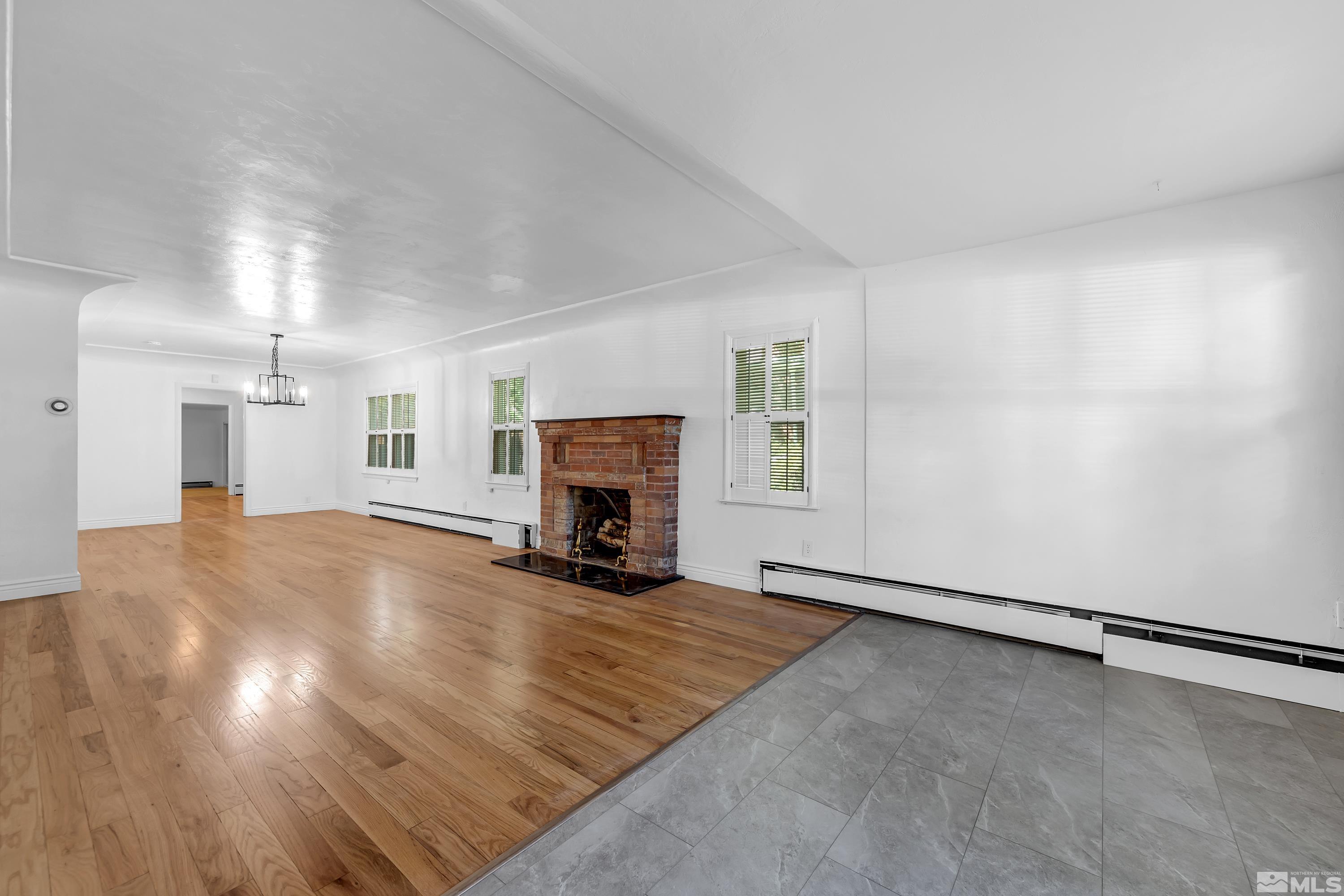 2199 Humboldt Street Reno, NV 89509 - Photo 2 of 35 an empty room with furniture and fireplace