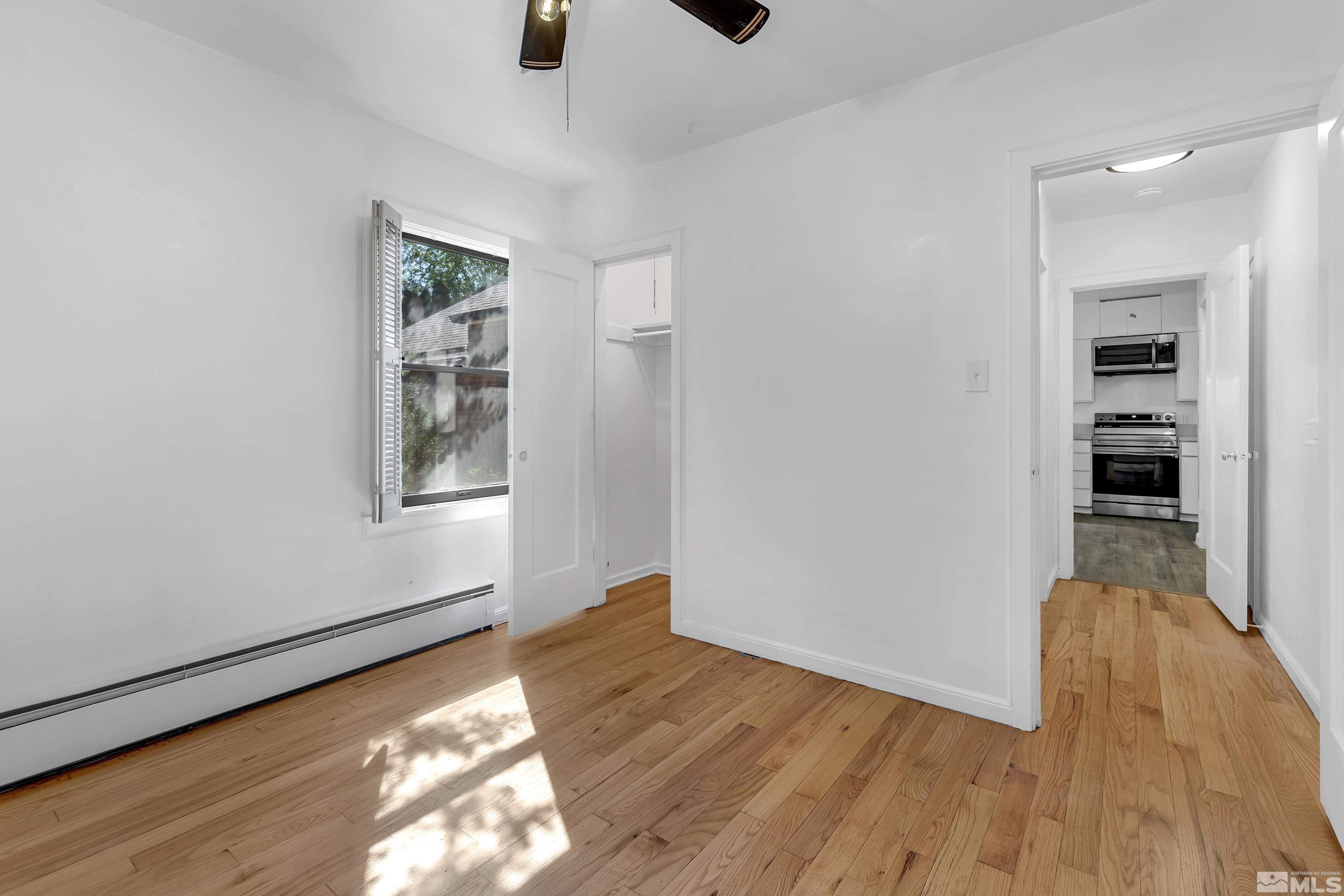 2199 Humboldt Street Reno, NV 89509 - Photo 22 of 35 an empty room with wooden floor and windows