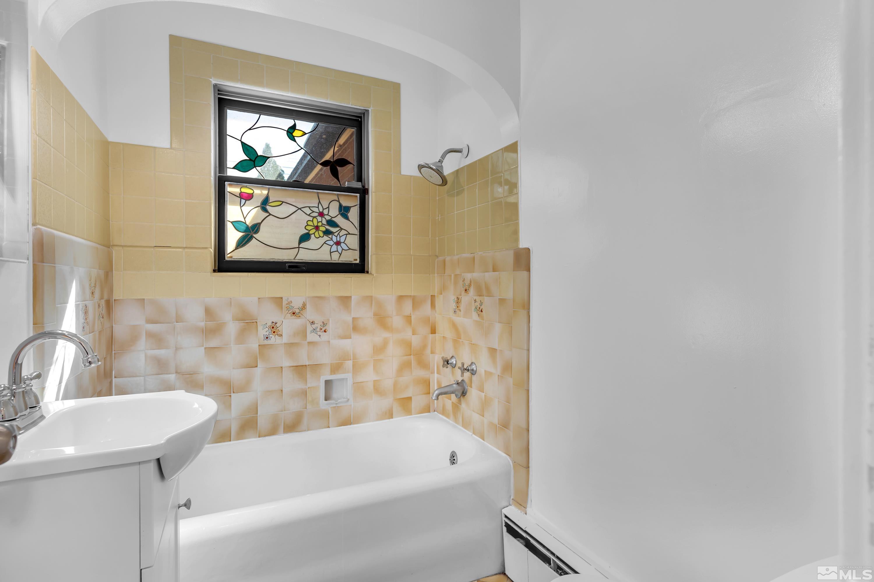 2199 Humboldt Street Reno, NV 89509 - Photo 23 of 35 a bathroom with a bathtub and sink