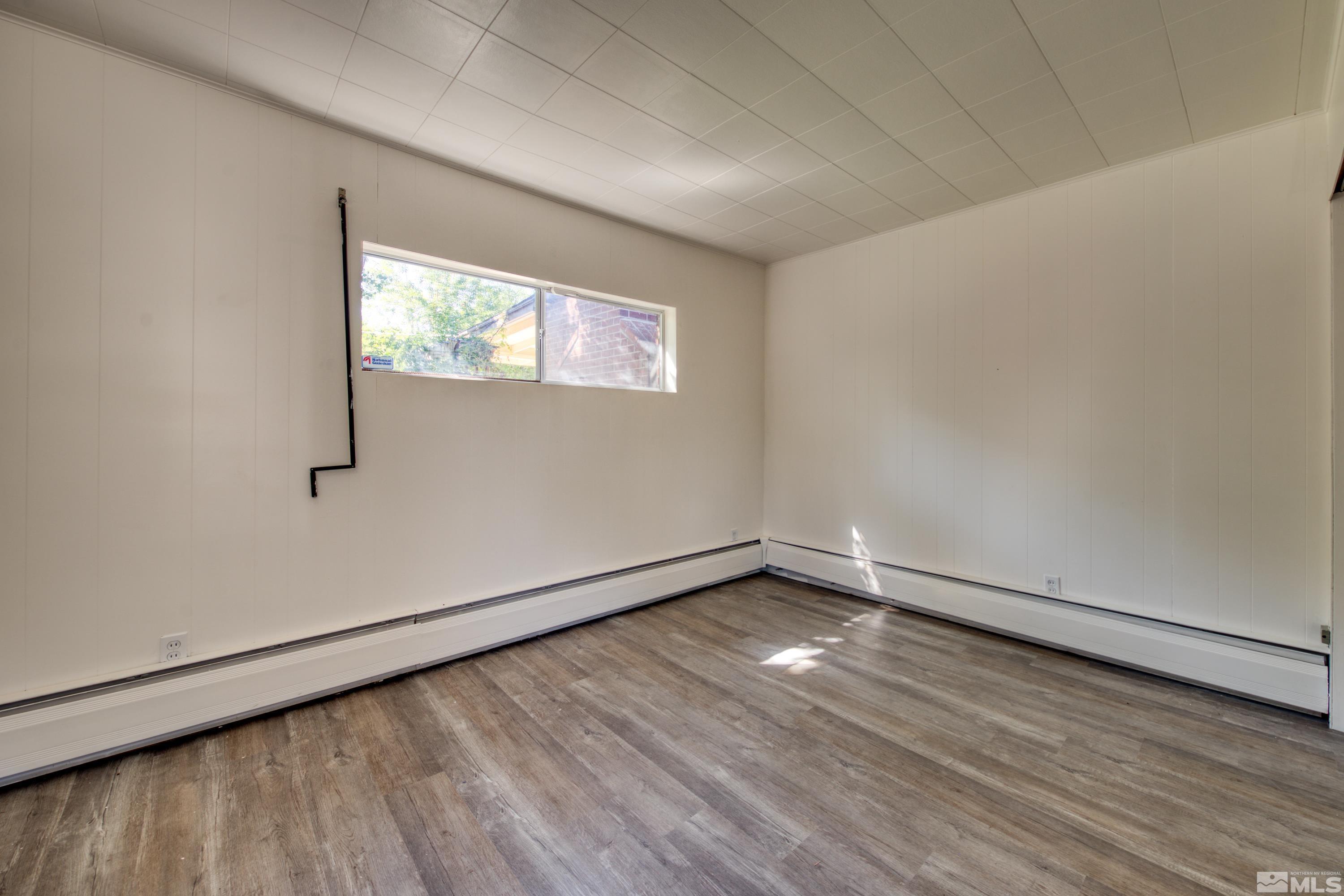 2199 Humboldt Street Reno, NV 89509 - Photo 24 of 35 a view of an empty room with wooden floor and a window