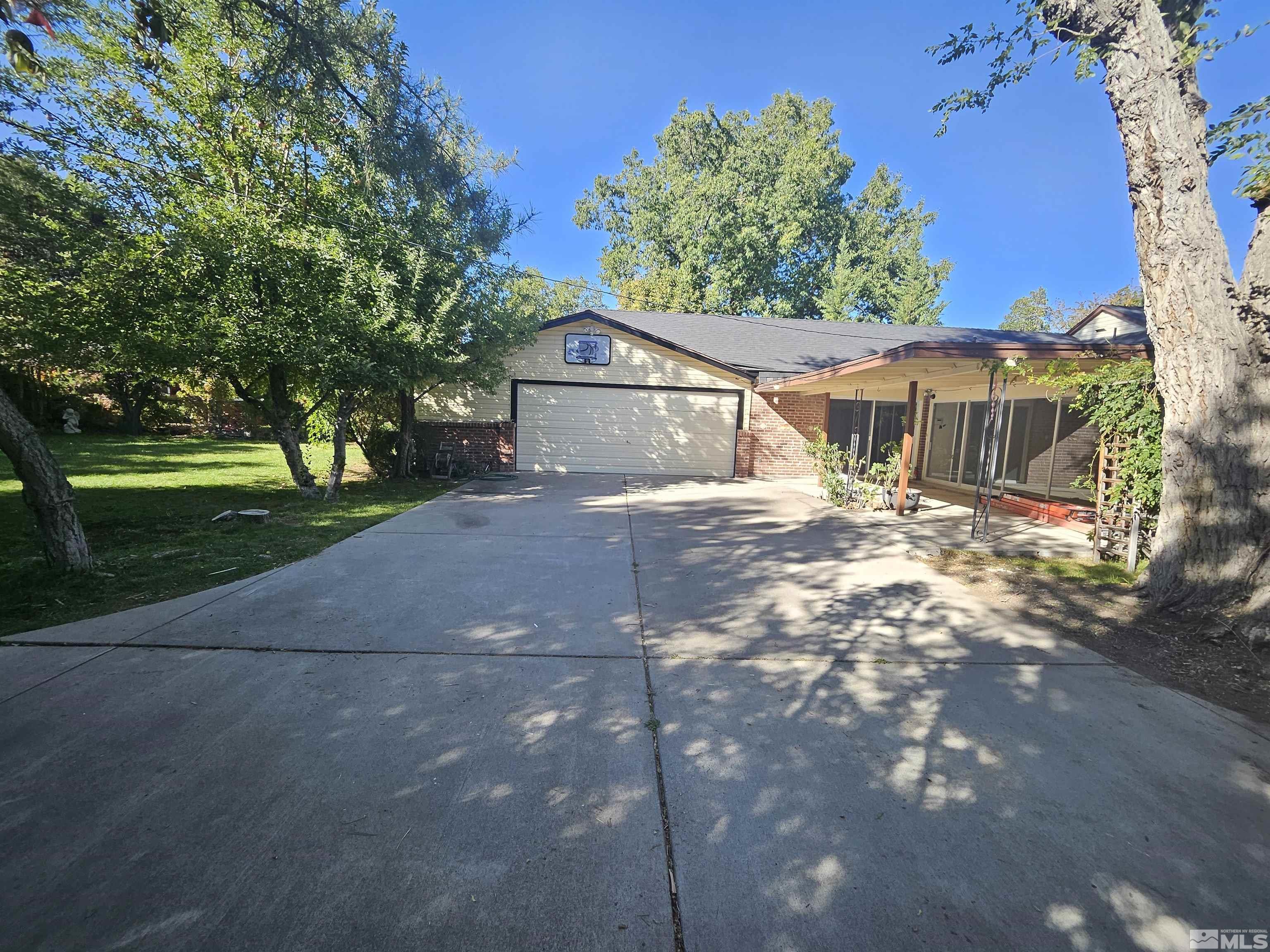 2199 Humboldt Street Reno, NV 89509 - Photo 29 of 35 a front view of a house with a yard and garage
