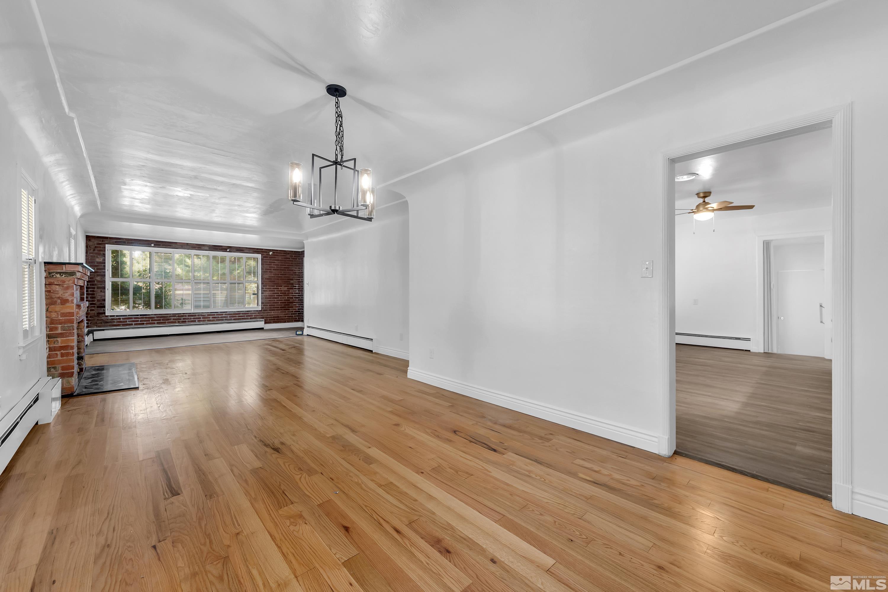 2199 Humboldt Street Reno, NV 89509 - Photo 4 of 35 wooden floor in an empty room with a window