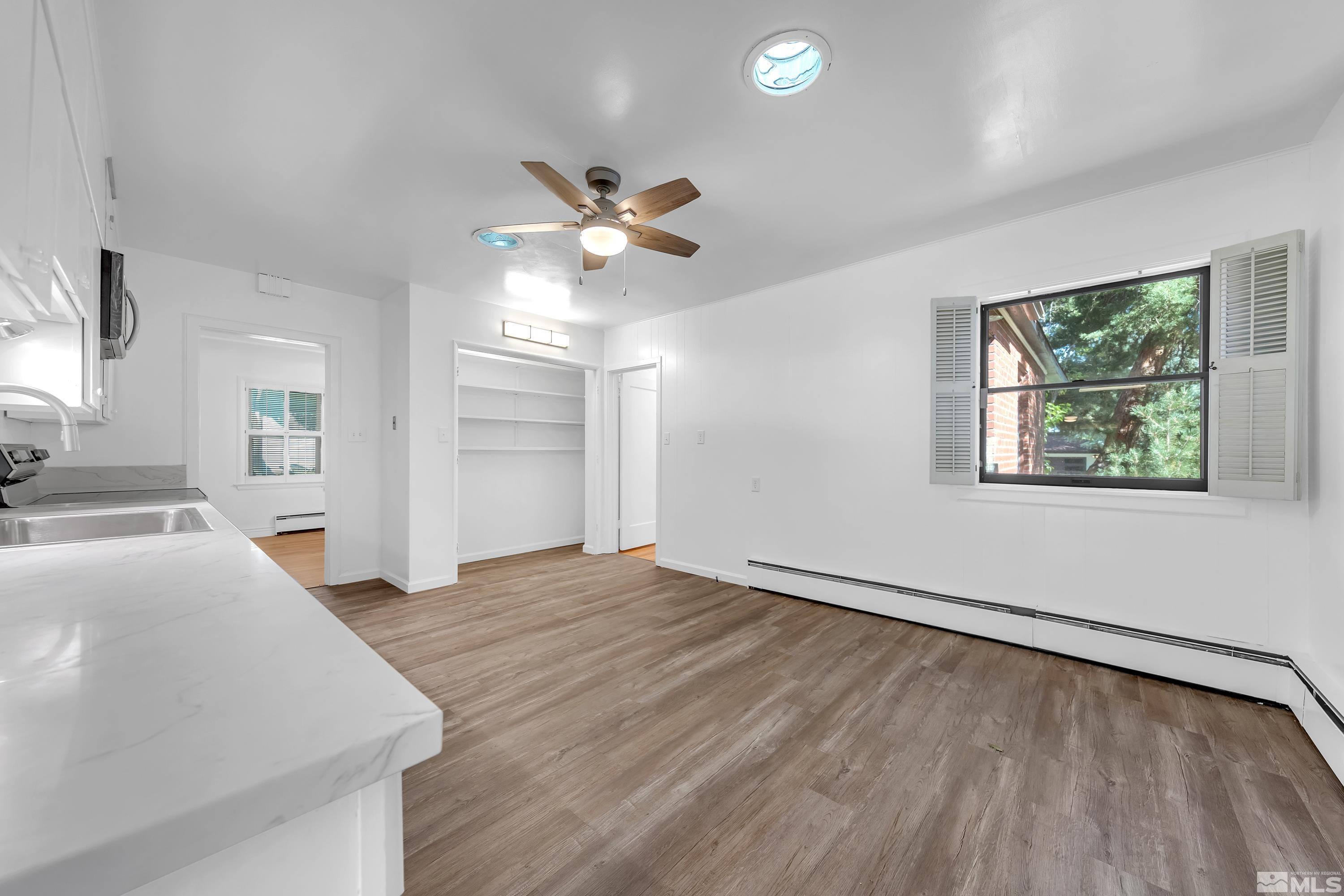2199 Humboldt Street Reno, NV 89509 - Photo 8 of 35 a view of empty room with wooden floor and fan