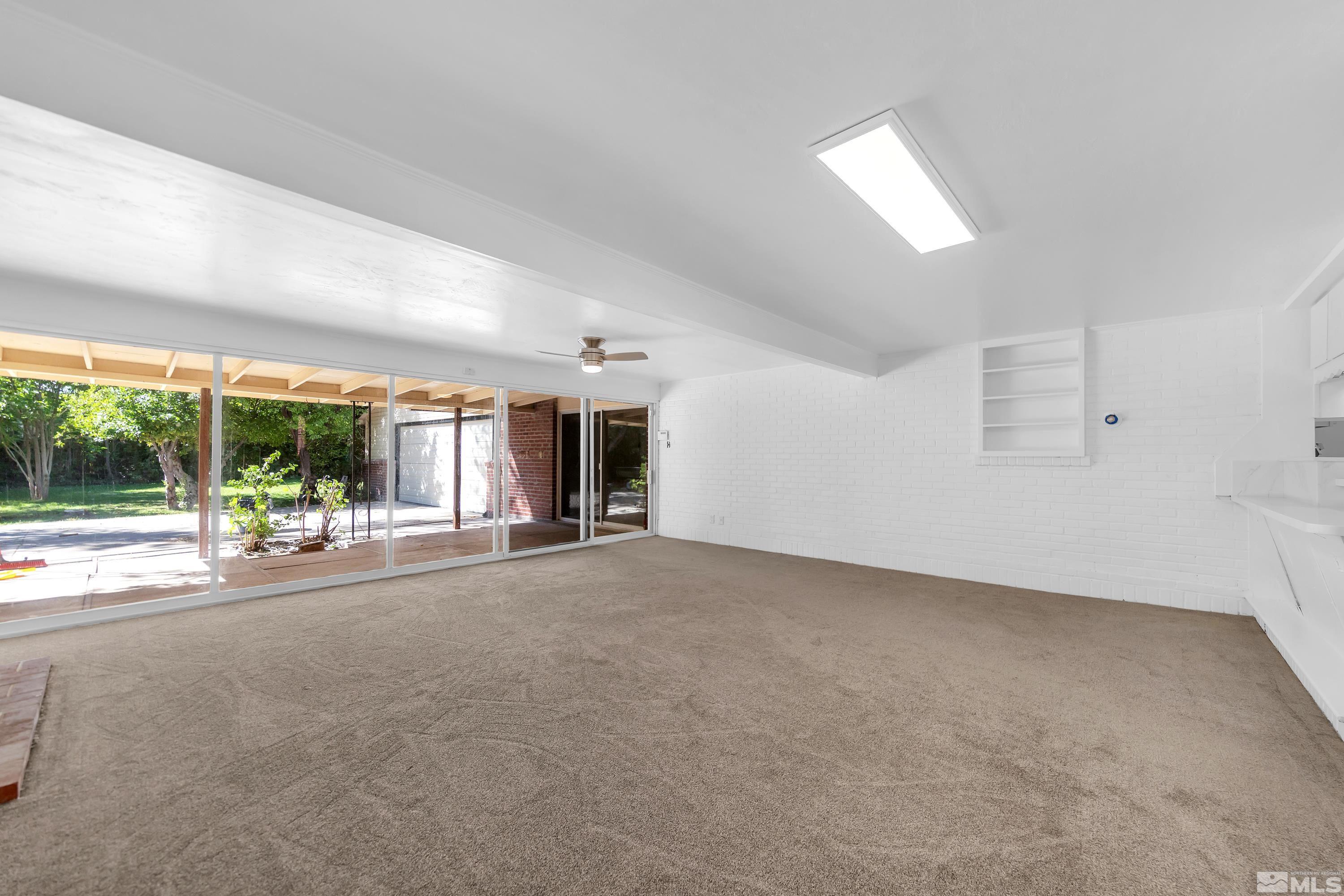 2199 Humboldt Street Reno, NV 89509 - Photo 10 of 35 a view of a livingroom with an empty space and a fireplace