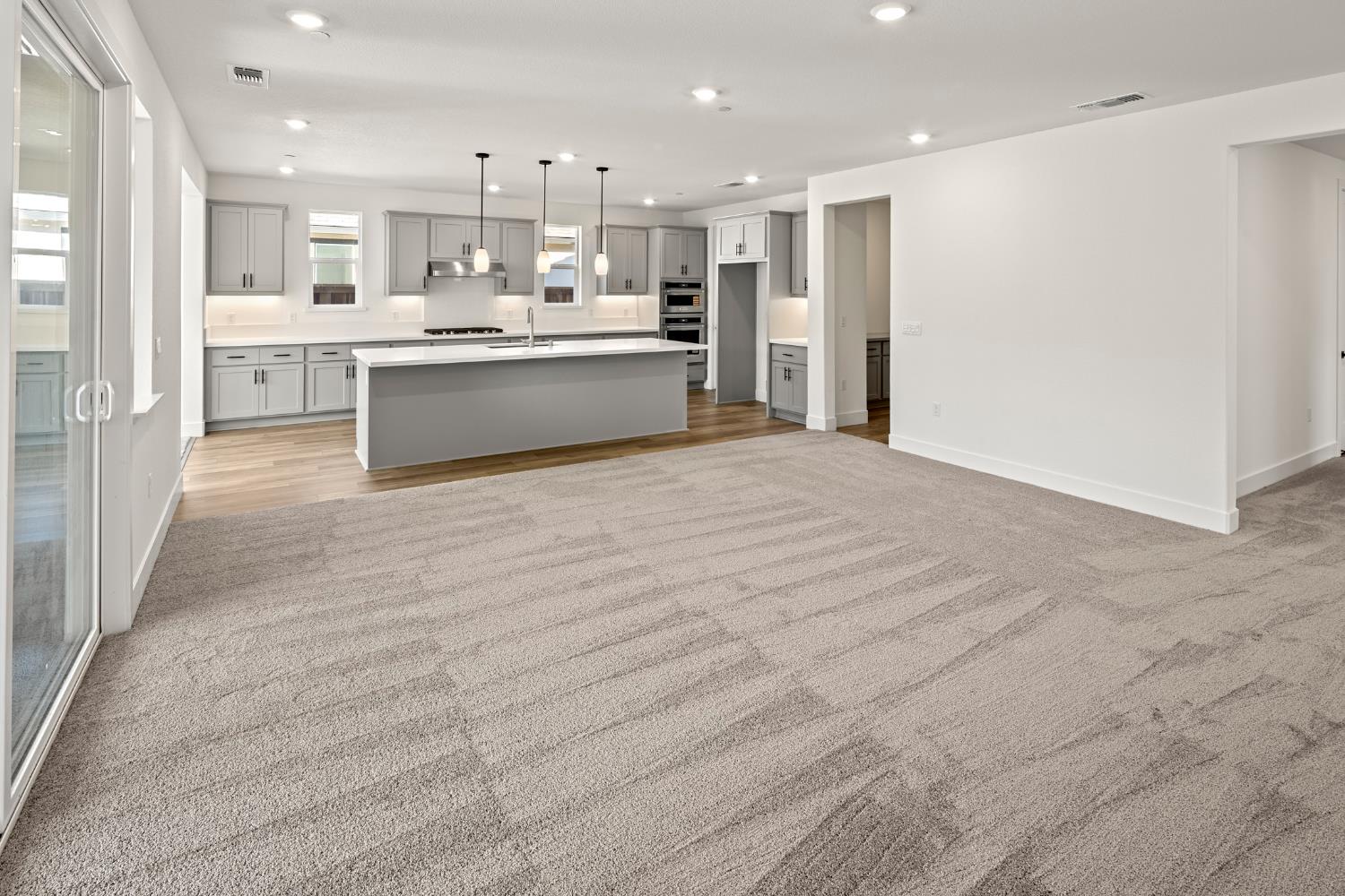 2425 Briar Meadow Circle Auburn, CA 95603 - Photo 15 of 51 a large kitchen with kitchen island a sink a stove a refrigerator and a cabinets