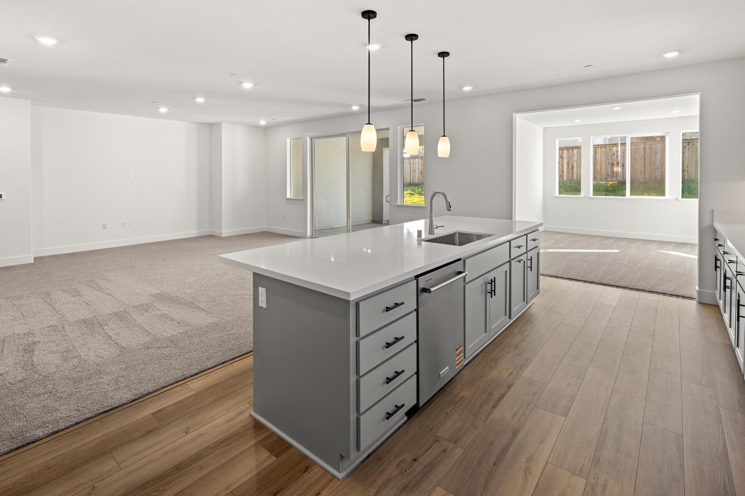 2425 Briar Meadow Circle Auburn, CA 95603 - Photo 17 of 51 a kitchen with a stove a sink wooden floor and a window