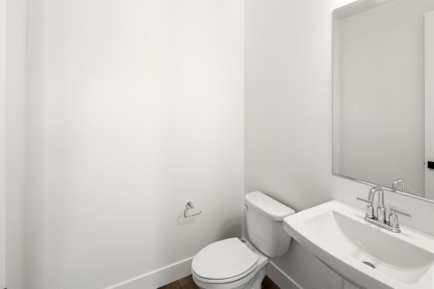 2425 Briar Meadow Circle Auburn, CA 95603 - Photo 24 of 51 a white toilet sitting next to a bathroom sink