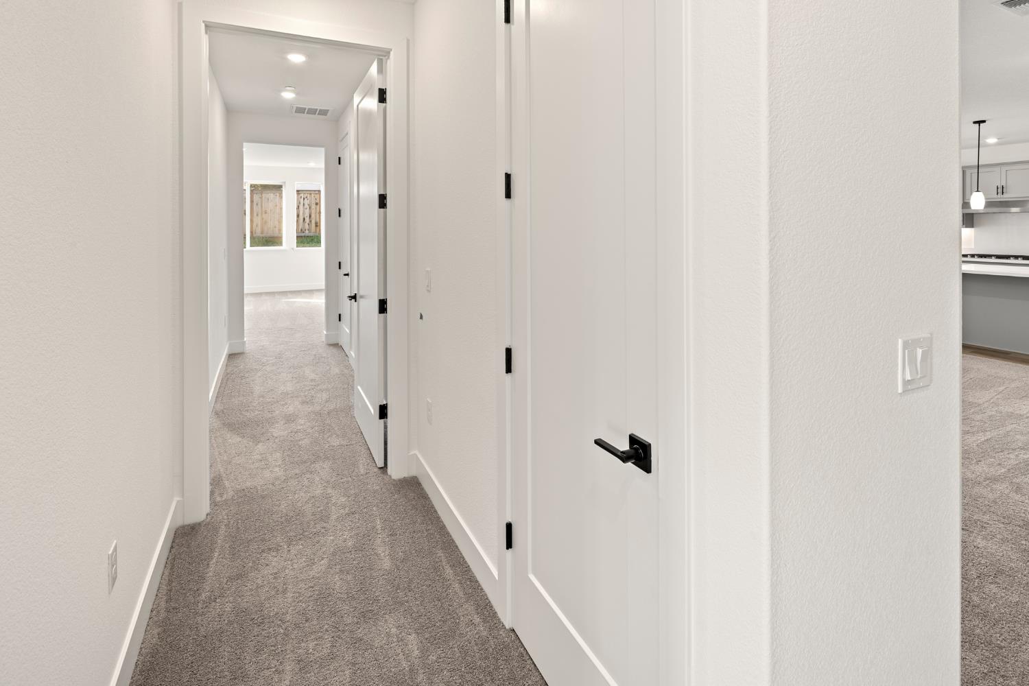 2425 Briar Meadow Circle Auburn, CA 95603 - Photo 25 of 51 a view of a hallway with wooden floor and staircase