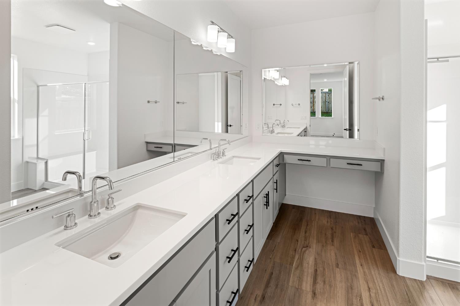 2425 Briar Meadow Circle Auburn, CA 95603 - Photo 27 of 51 a bathroom with a sink double vanity granite and a large mirror