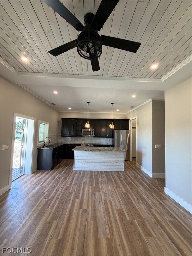 11595 Tomato Road Naples, FL 34114 - Photo 5 of 15 a view of a kitchen with a sink and cabinets