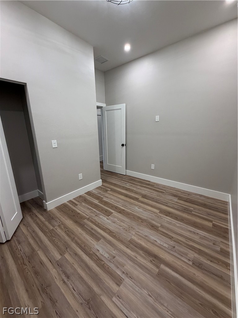 11595 Tomato Road Naples, FL 34114 - Photo 8 of 15 a view of room with wooden floor