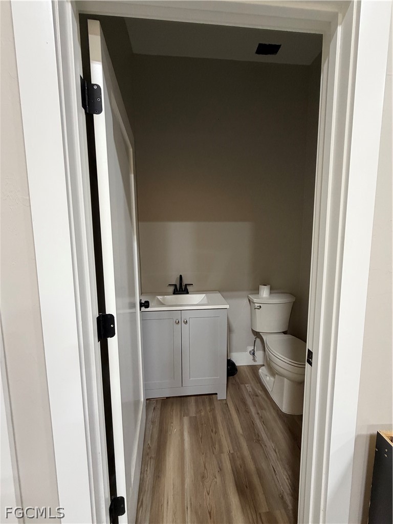 11595 Tomato Road Naples, FL 34114 - Photo 10 of 15 a bathroom with a sink and toilet