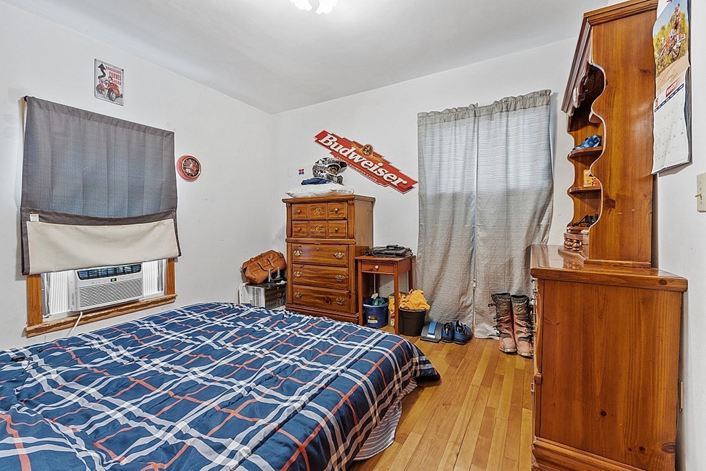 8 Athens Avenue Rutland, MA 01543 - Photo 23 of 42 a bedroom with a bed and dresser with wooden floor