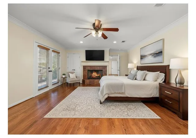 a living room with furniture fireplace and flat screen tv