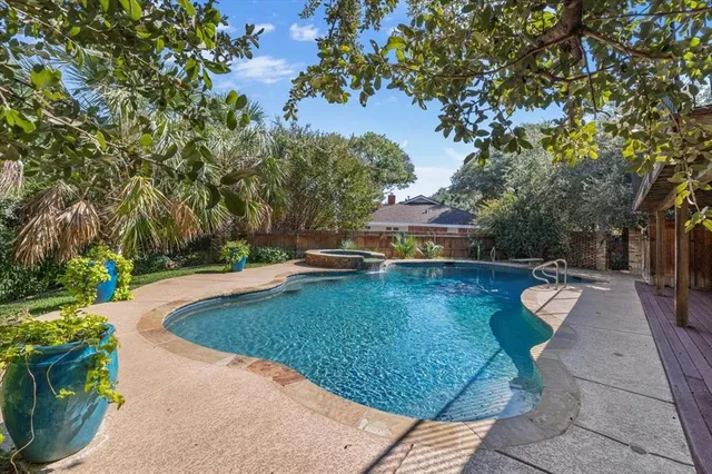 a view of a swimming pool with a patio
