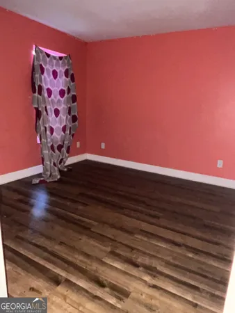 a view of entryway with wooden floor