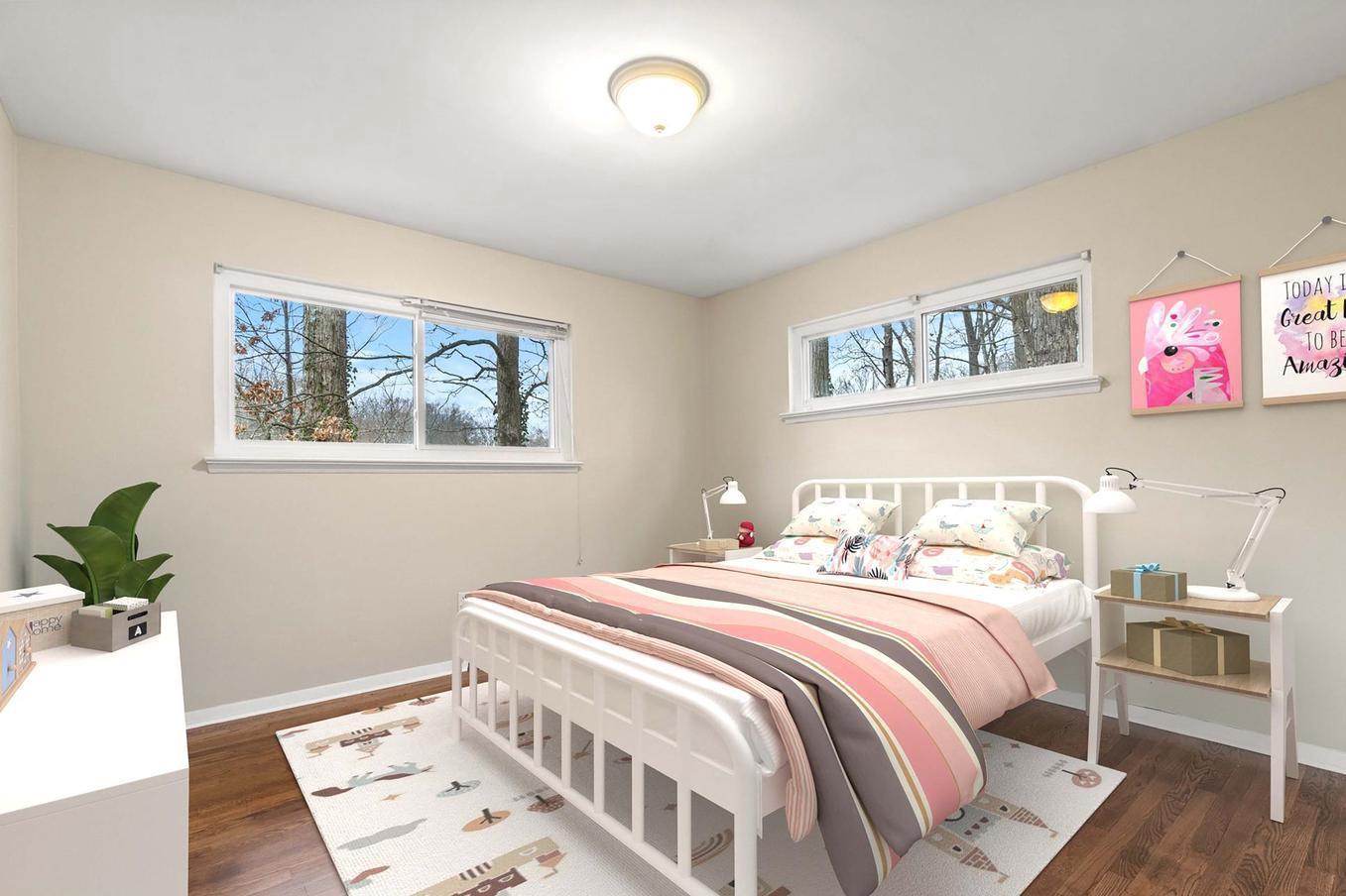 6505 Farley Street Springfield, VA 22152 - Photo 15 of 30 a bedroom with a bed and a painting on the wall