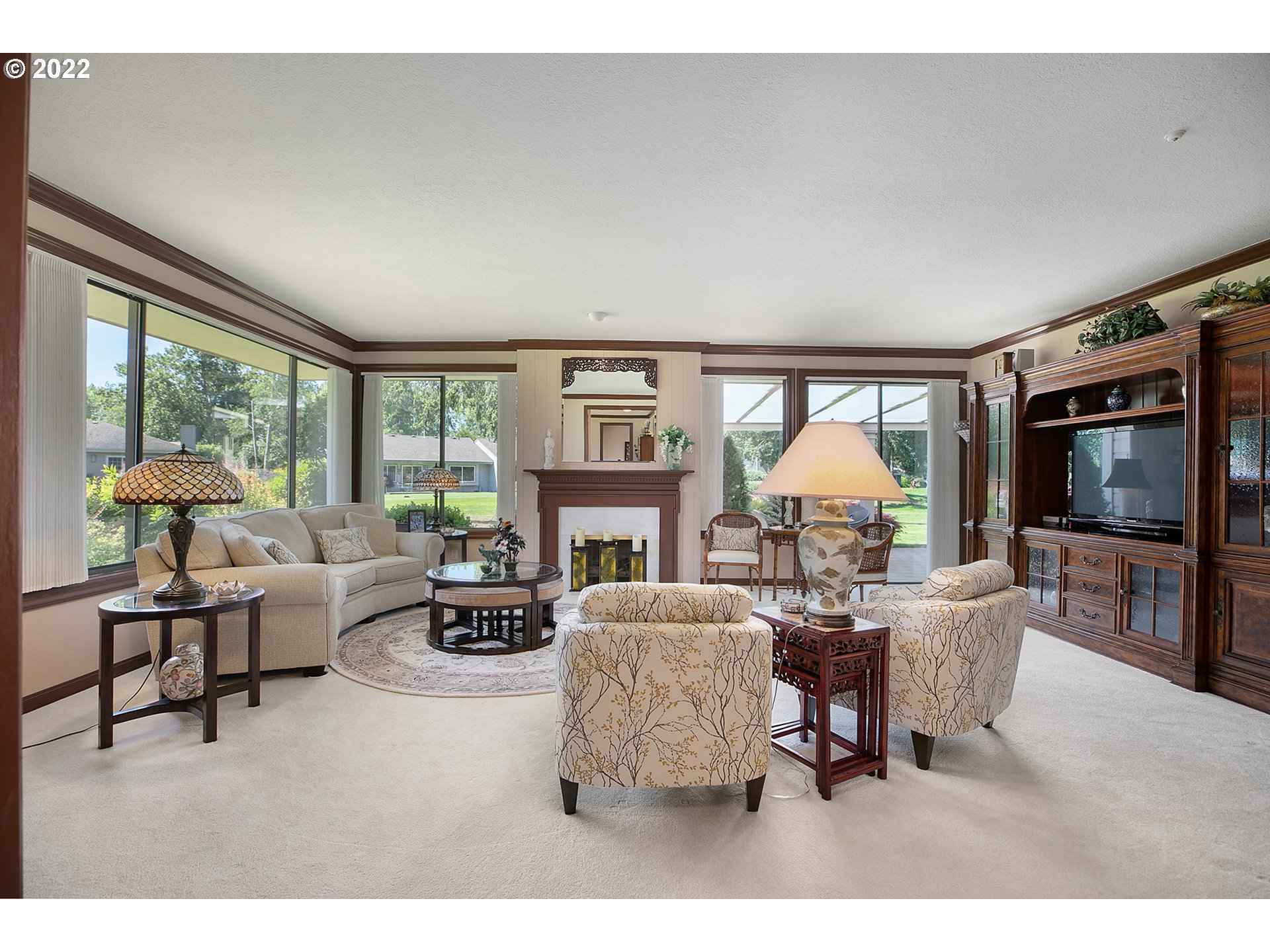 32221 Southwest Boones Bend Road Wilsonville, OR 97070 - Photo 11 of 32 a living room with fireplace furniture and a flat screen tv