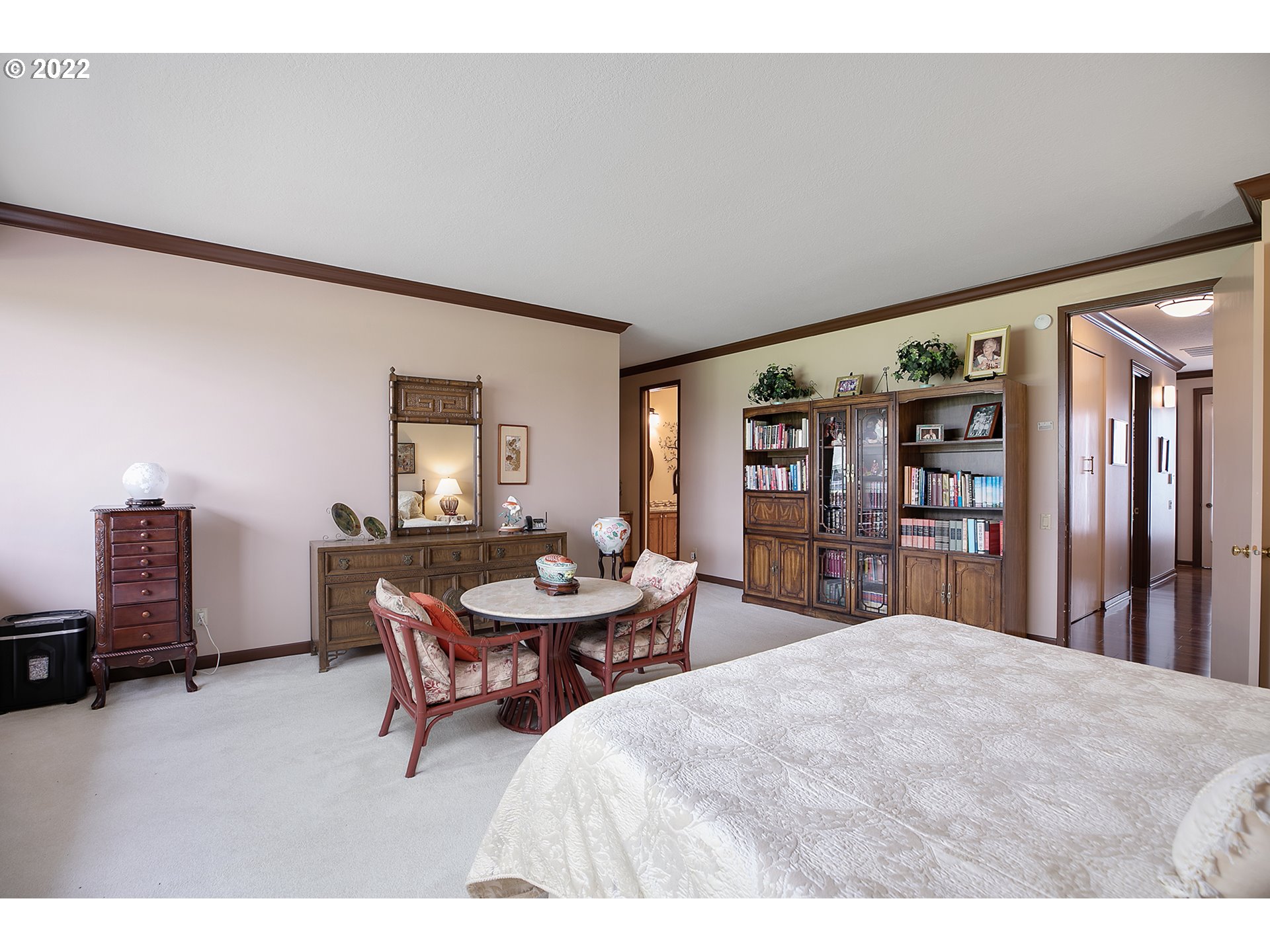 32221 Southwest Boones Bend Road Wilsonville, OR 97070 - Photo 21 of 32 a bedroom with a bed a dresser and book shelf