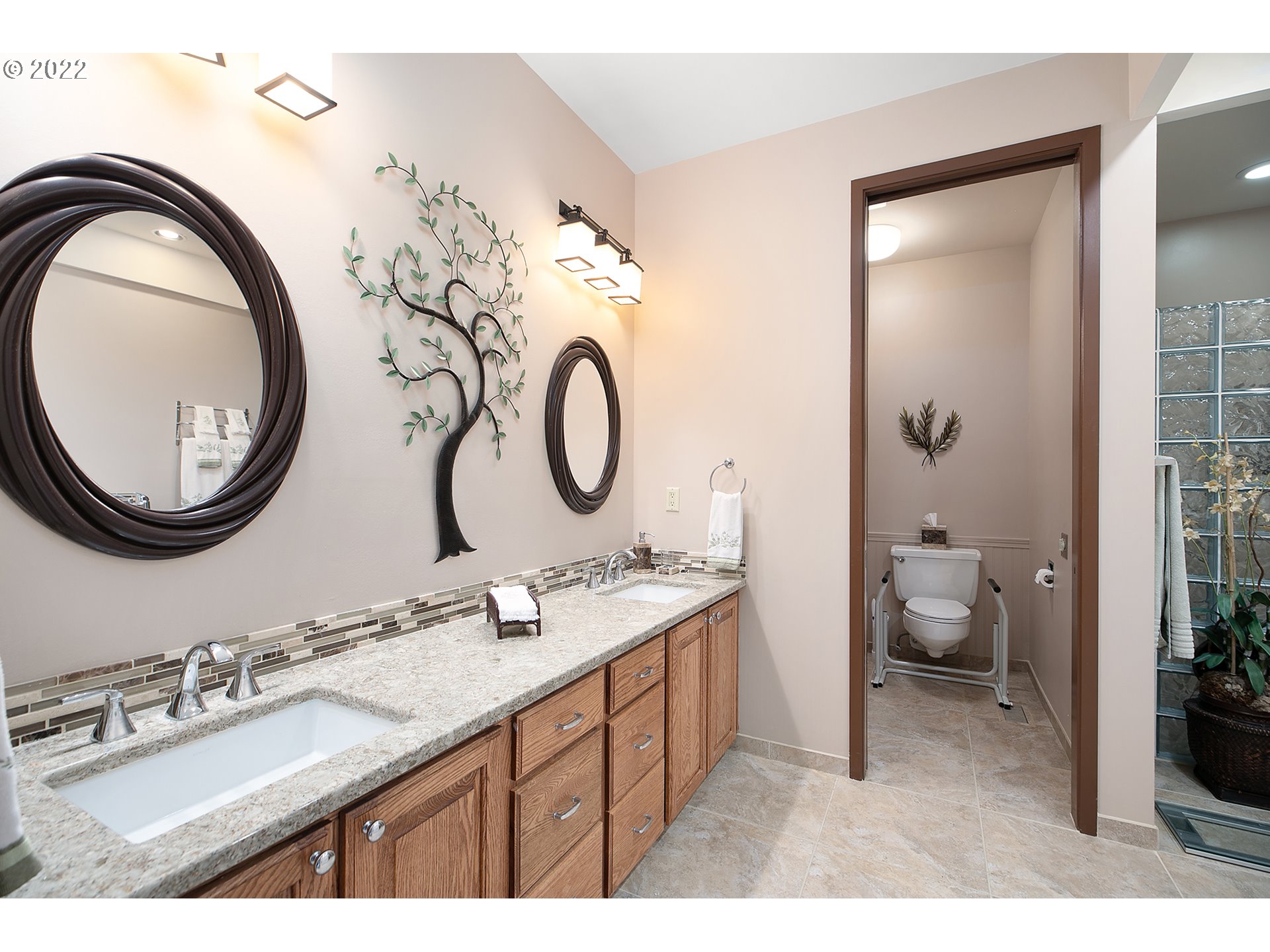 32221 Southwest Boones Bend Road Wilsonville, OR 97070 - Photo 23 of 32 a bathroom with a granite countertop toilet a sink and a mirror