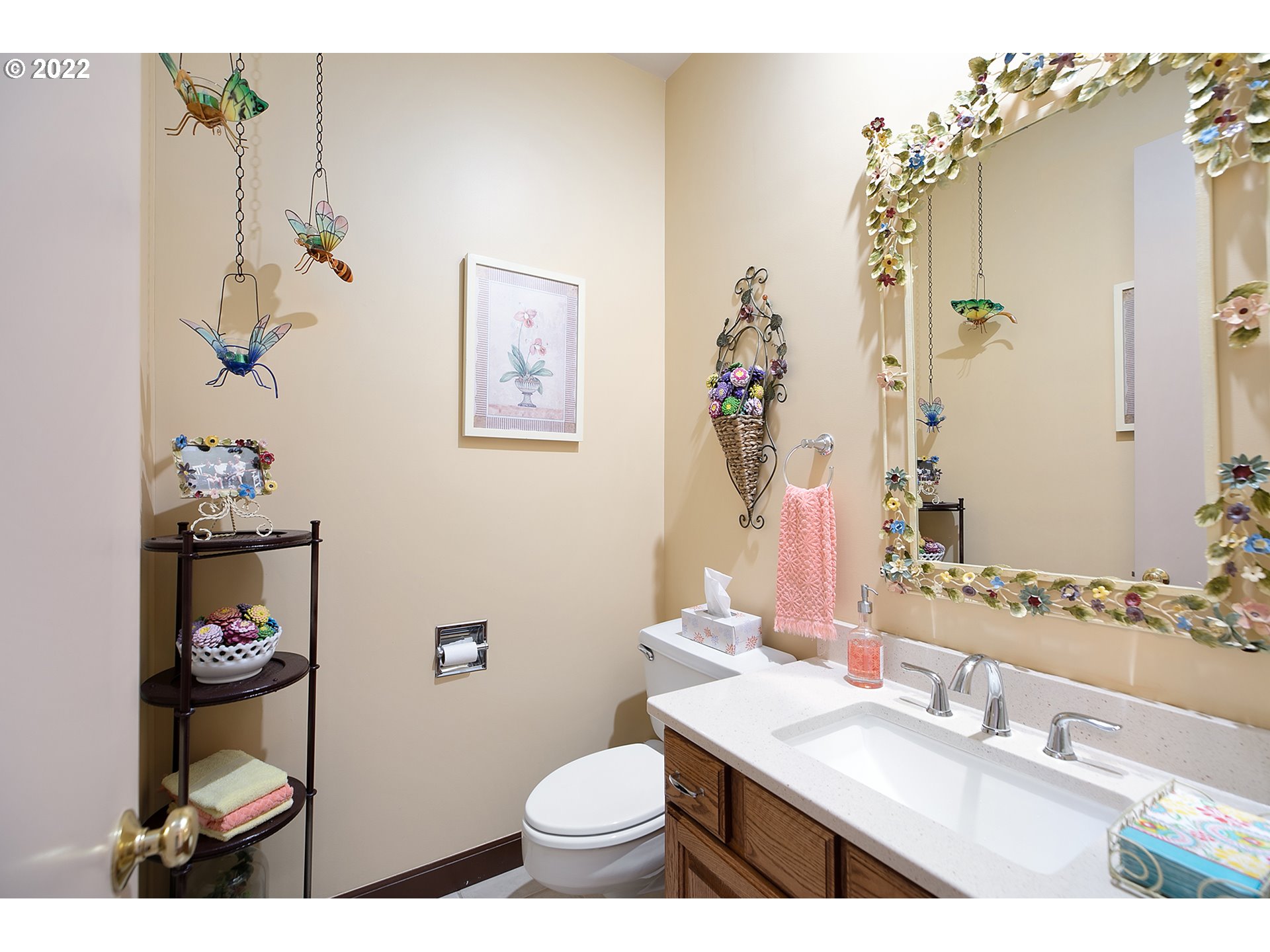 32221 Southwest Boones Bend Road Wilsonville, OR 97070 - Photo 29 of 32 a bathroom with a sink a toilet and a mirror