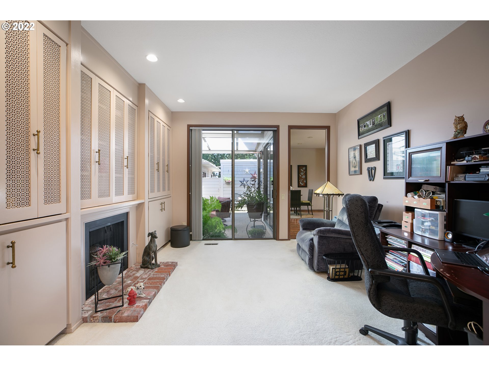 32221 Southwest Boones Bend Road Wilsonville, OR 97070 - Photo 30 of 32 a living room with furniture a fireplace and a flat screen tv