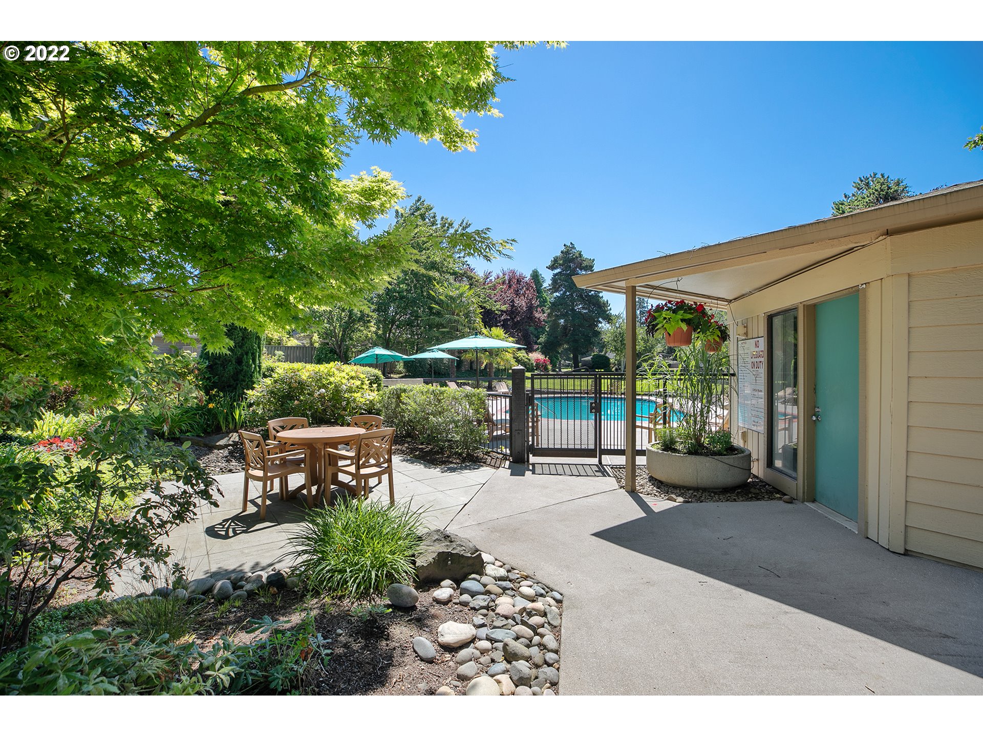 32221 Southwest Boones Bend Road Wilsonville, OR 97070 - Photo 32 of 32 a backyard of a house with table and chairs