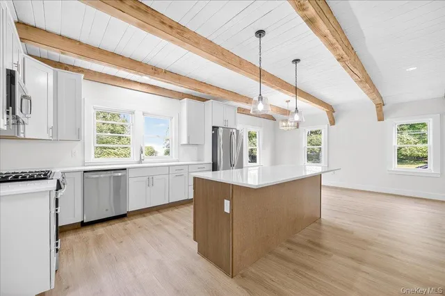 a bathroom with a sink a vanity and a mirror