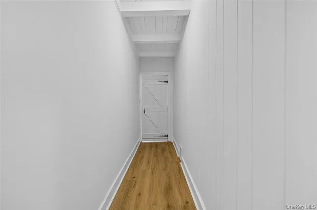 a view of a house with a yard and pathway