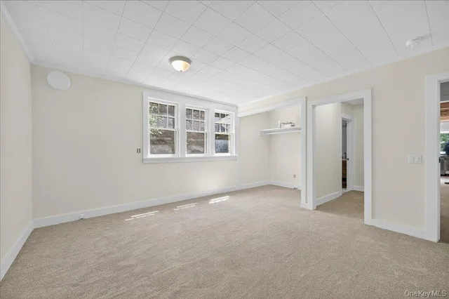 a bathroom with a sink a toilet and a window