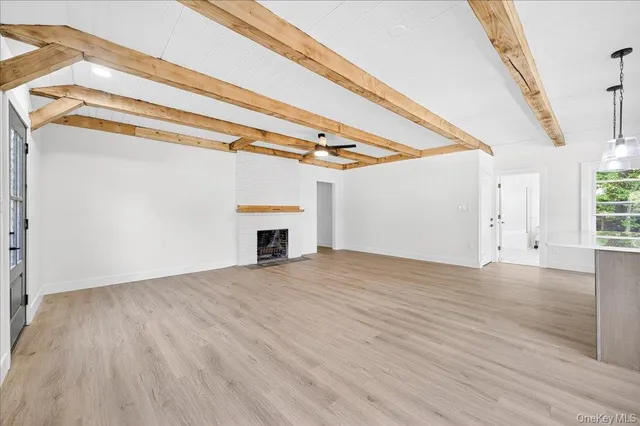 a kitchen with a stove a sink and a microwave