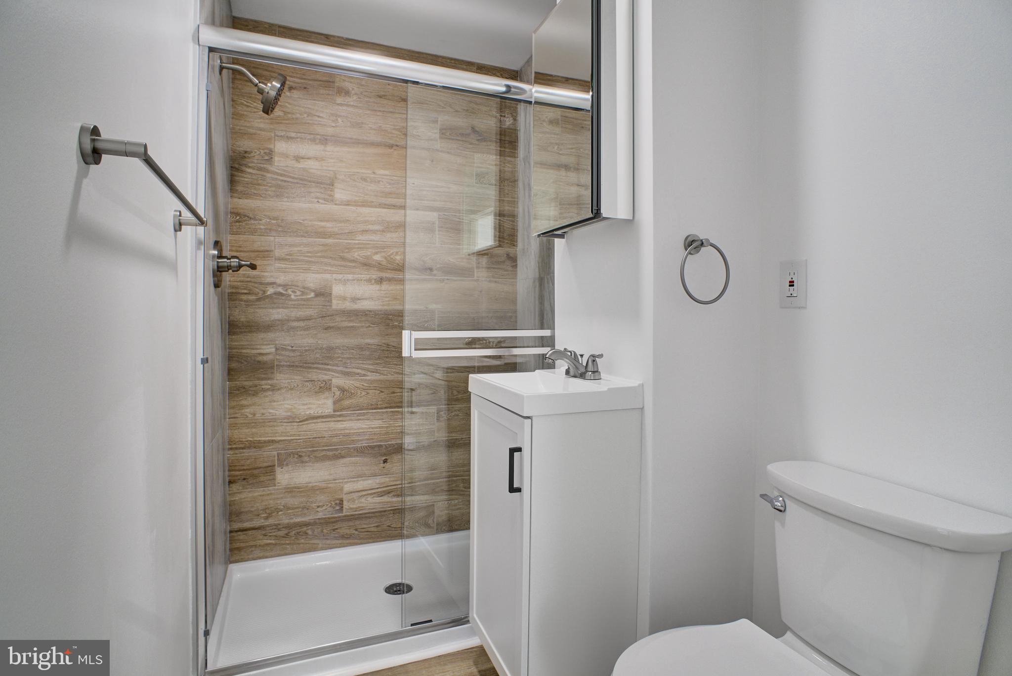 13 Jefferson Street Steelton, PA 17113 - Photo 13 of 21 a bathroom with a shower a toilet and a sink