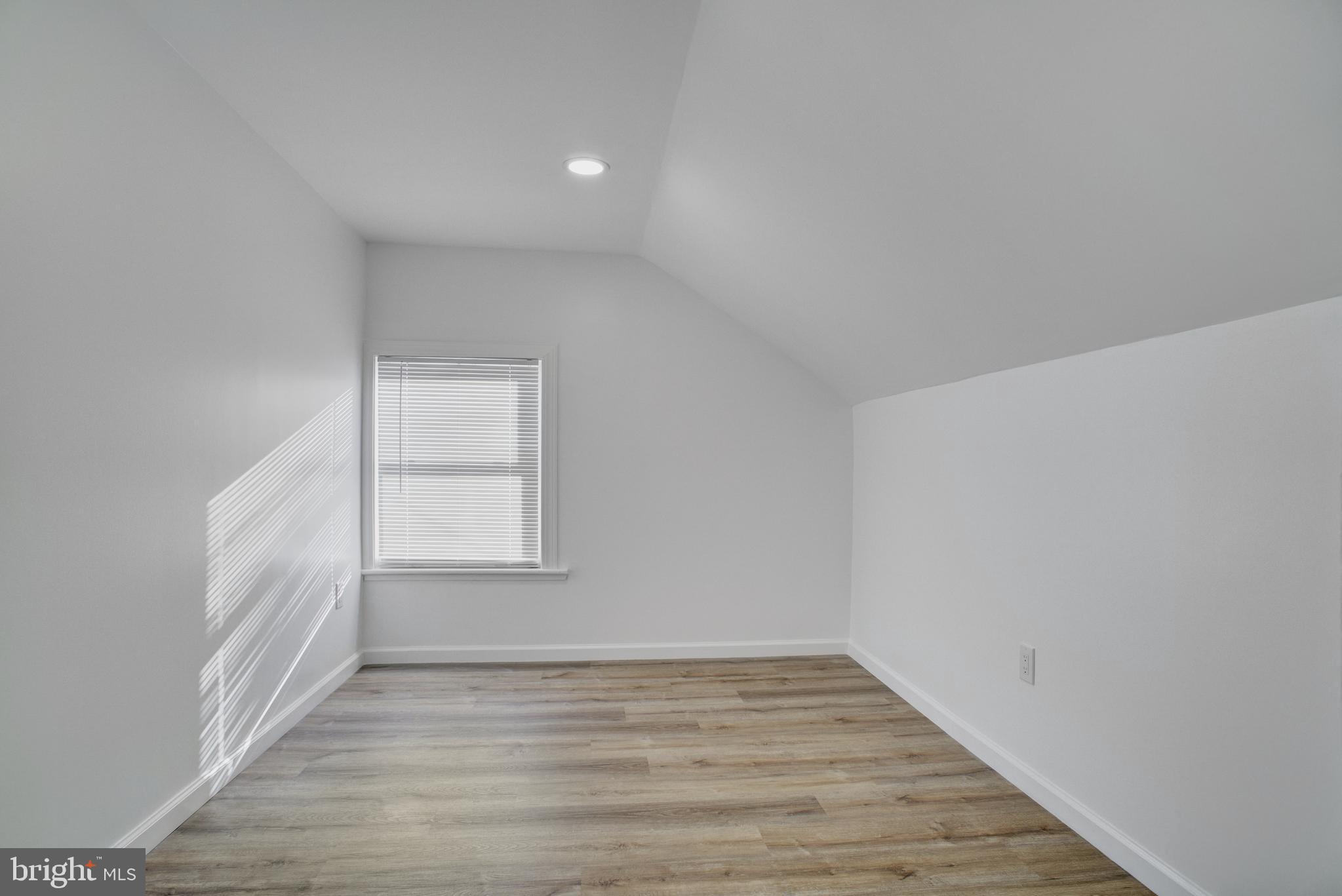 13 Jefferson Street Steelton, PA 17113 - Photo 16 of 21 a view of an empty room and wooden floor and a window