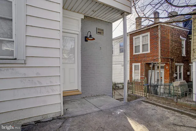 a view of a house with a door and a window