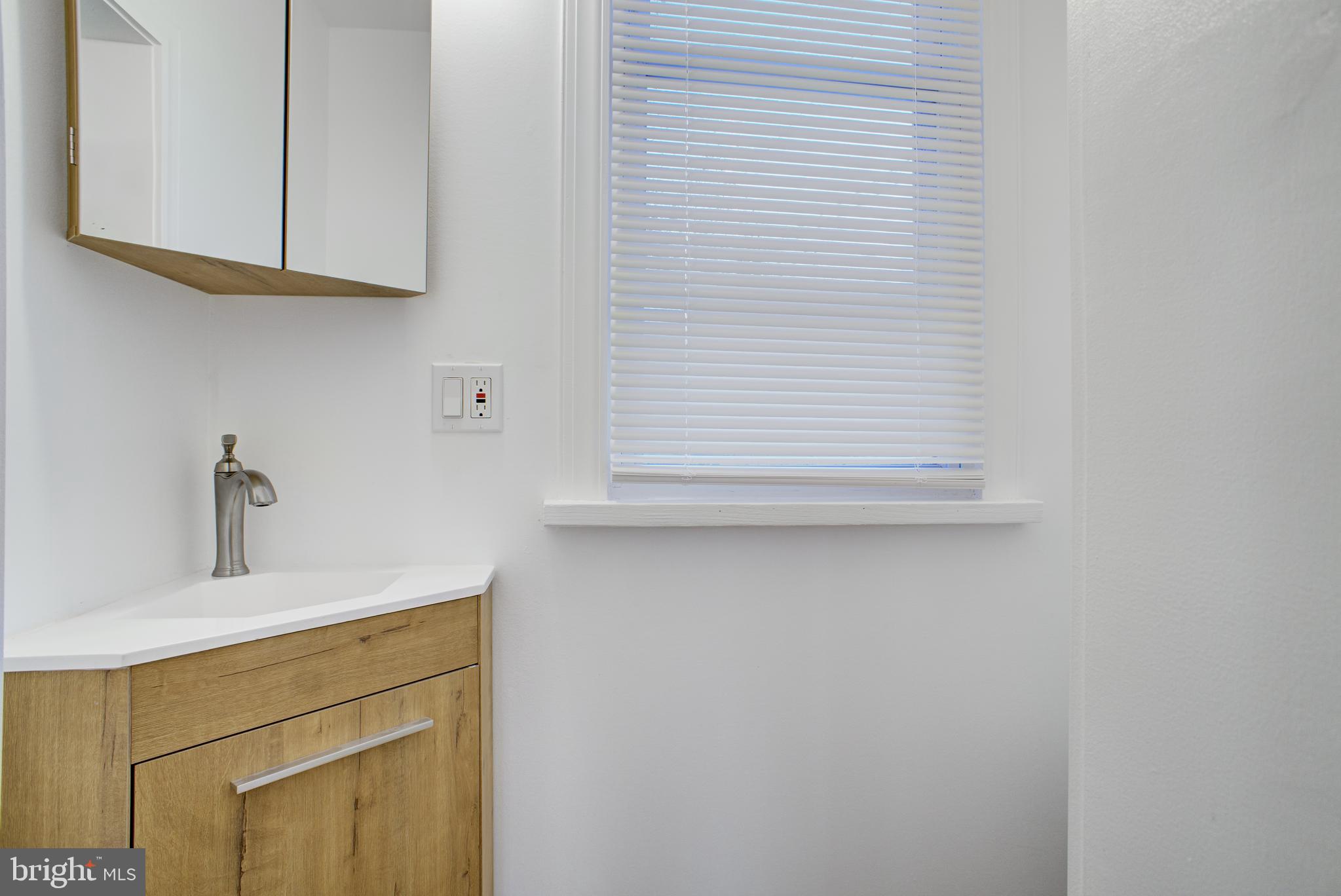 13 Jefferson Street Steelton, PA 17113 - Photo 6 of 21 a bathroom with a sink and a mirror