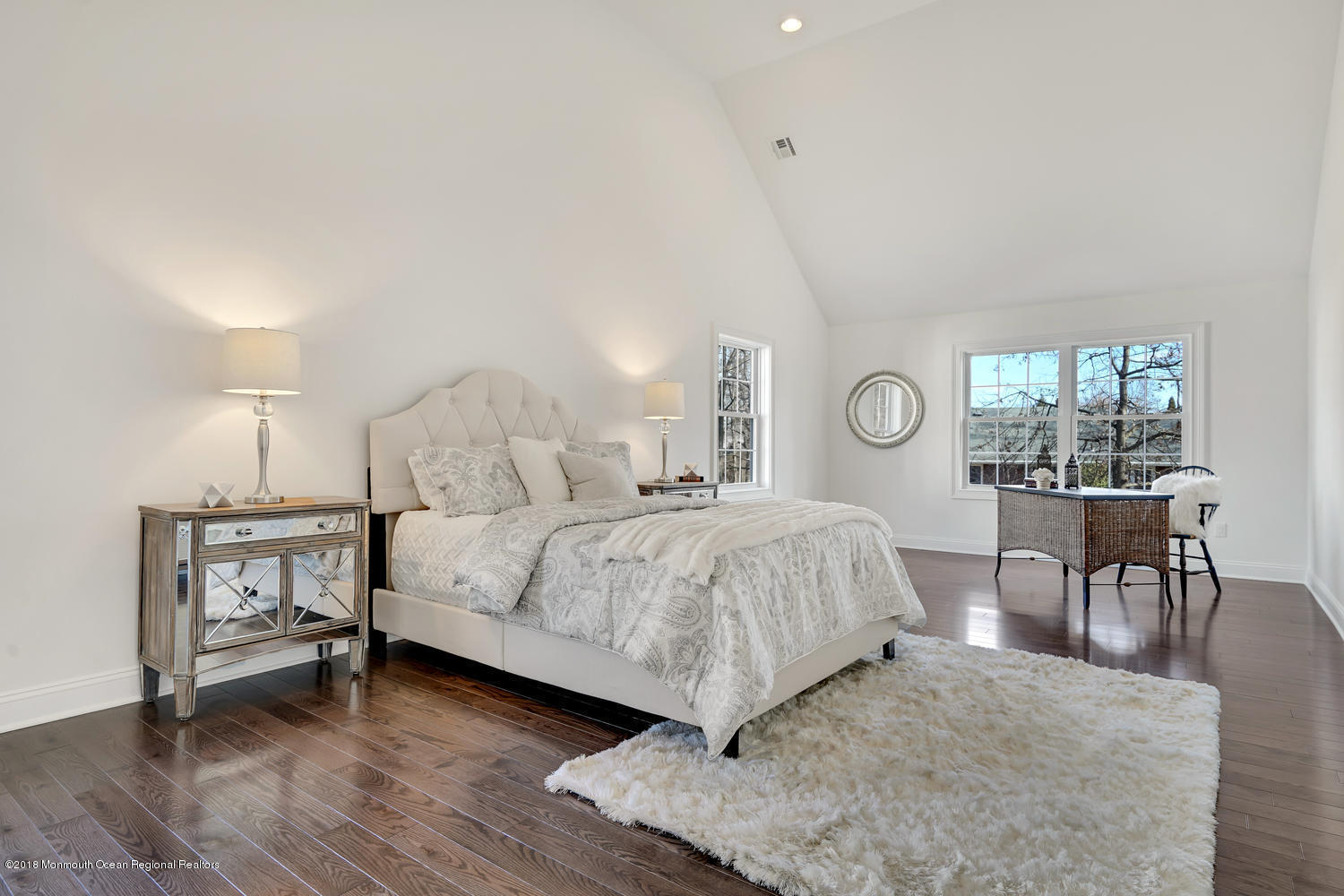 77 Stafford Road Colonia, NJ 07067 - Photo 14 of 17 a bedroom with a bed a table and chair with wooden floor