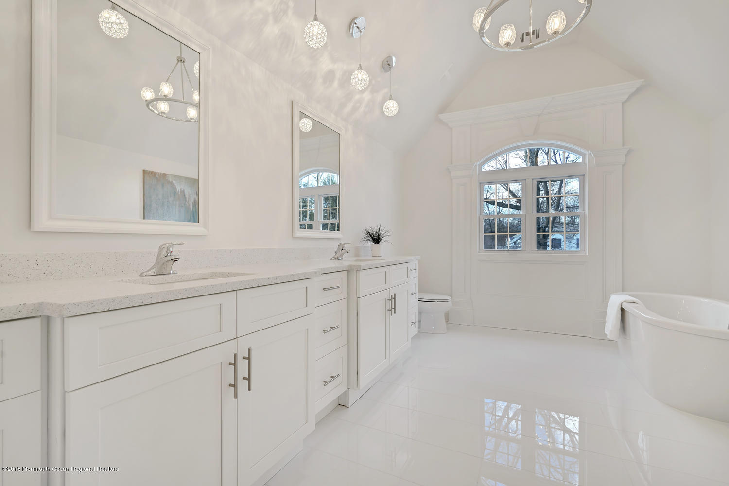 77 Stafford Road Colonia, NJ 07067 - Photo 15 of 17 a spacious bathroom with a double vanity sink mirror and a bathtub