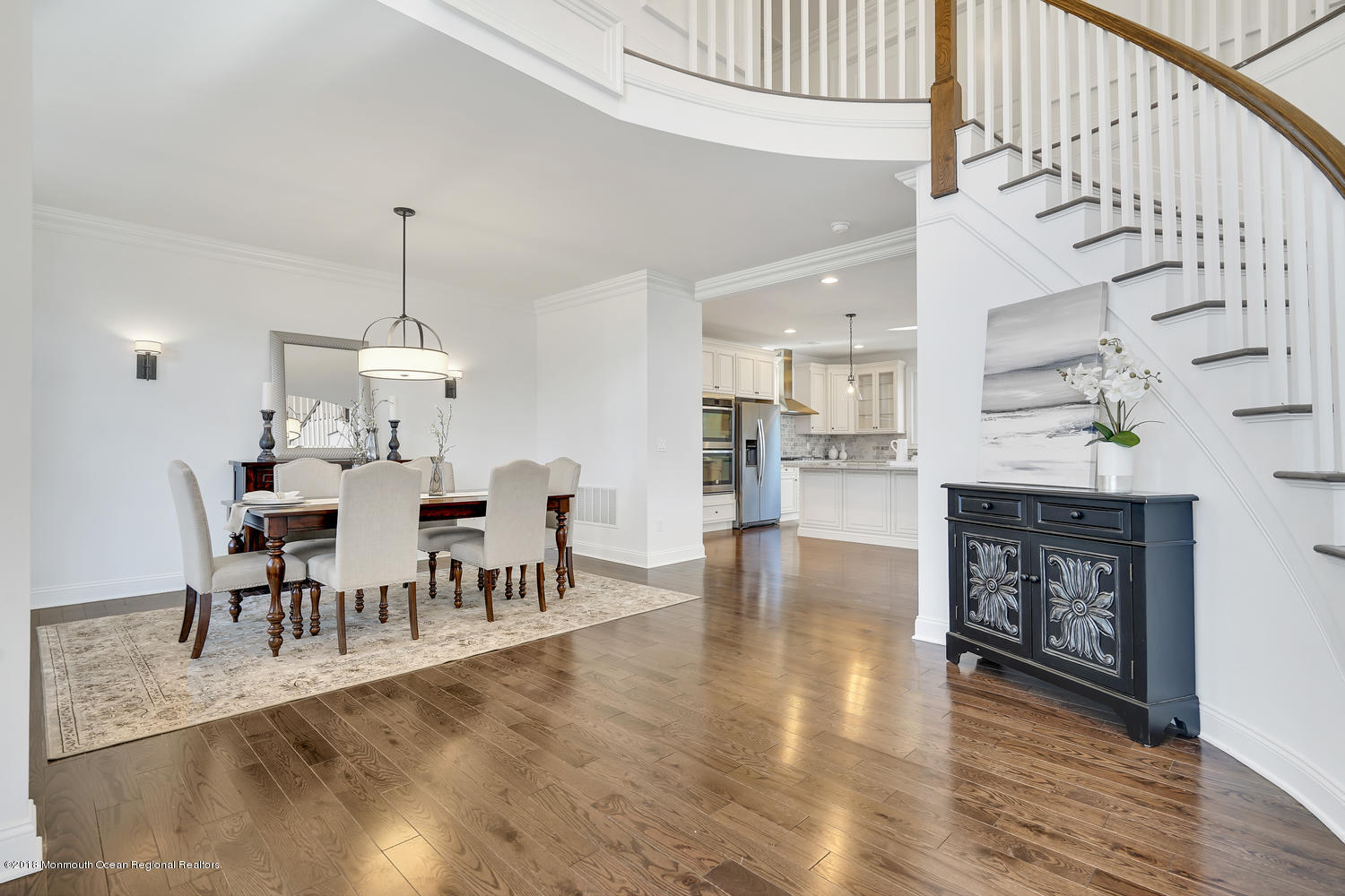 77 Stafford Road Colonia, NJ 07067 - Photo 4 of 17 a view of a dining room and livingroom with furniture wooden floor a chandelier