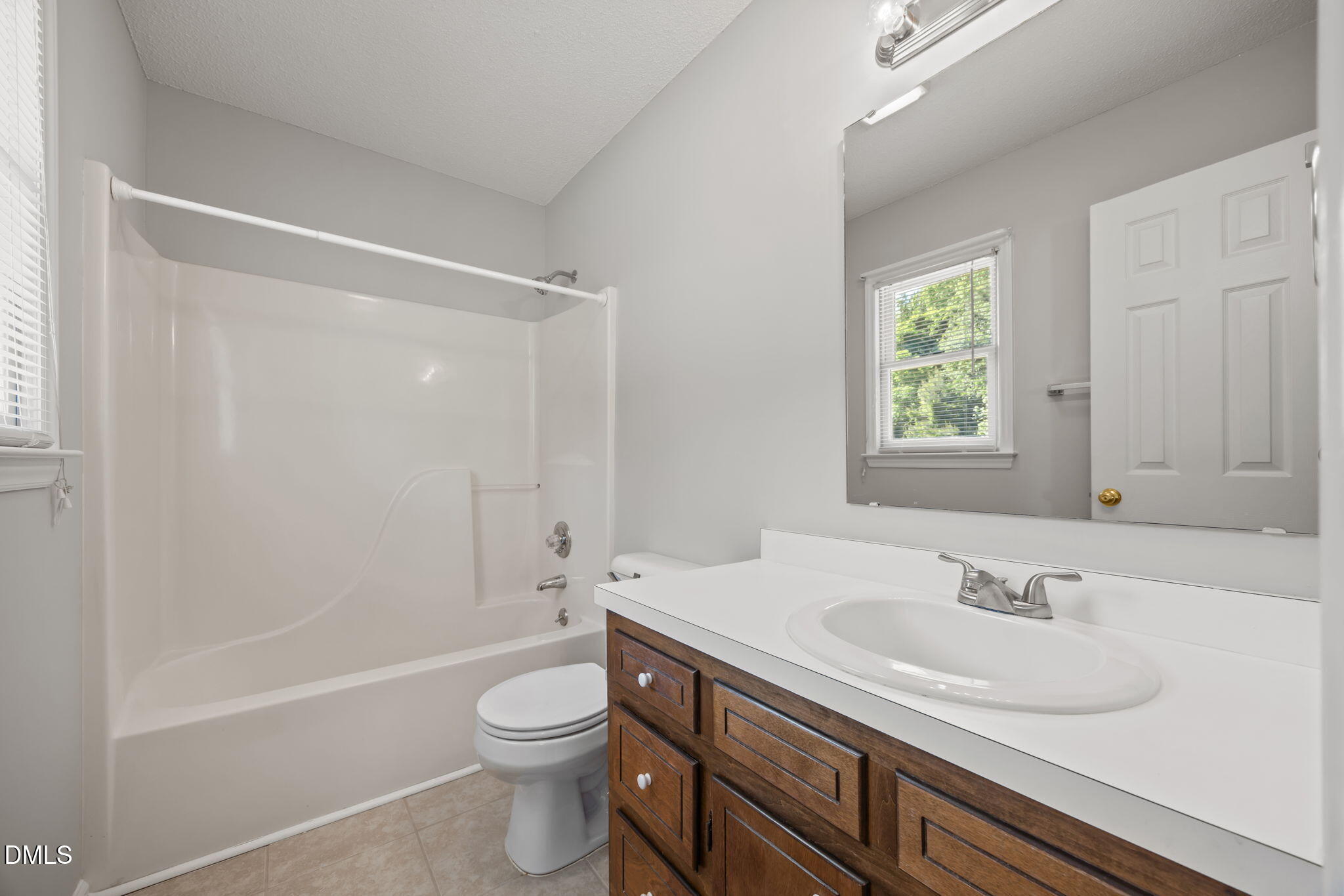 40 Circle Tree Lane Angier, NC 27501 - Photo 23 of 39 a bathroom with a sink a toilet and shower