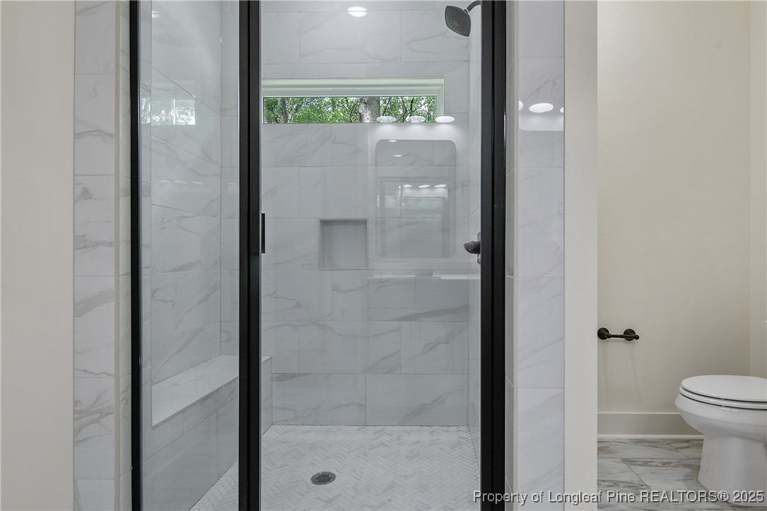 5210 Maxwell Road Stedman, NC 28391 - Photo 31 of 49 a bathroom with a shower and a toilet