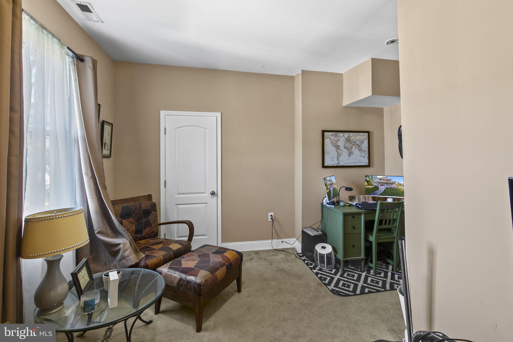 2600 Queen Anne Road Baltimore, MD 21216 - Photo 15 of 29 a room with furniture and gym equipment