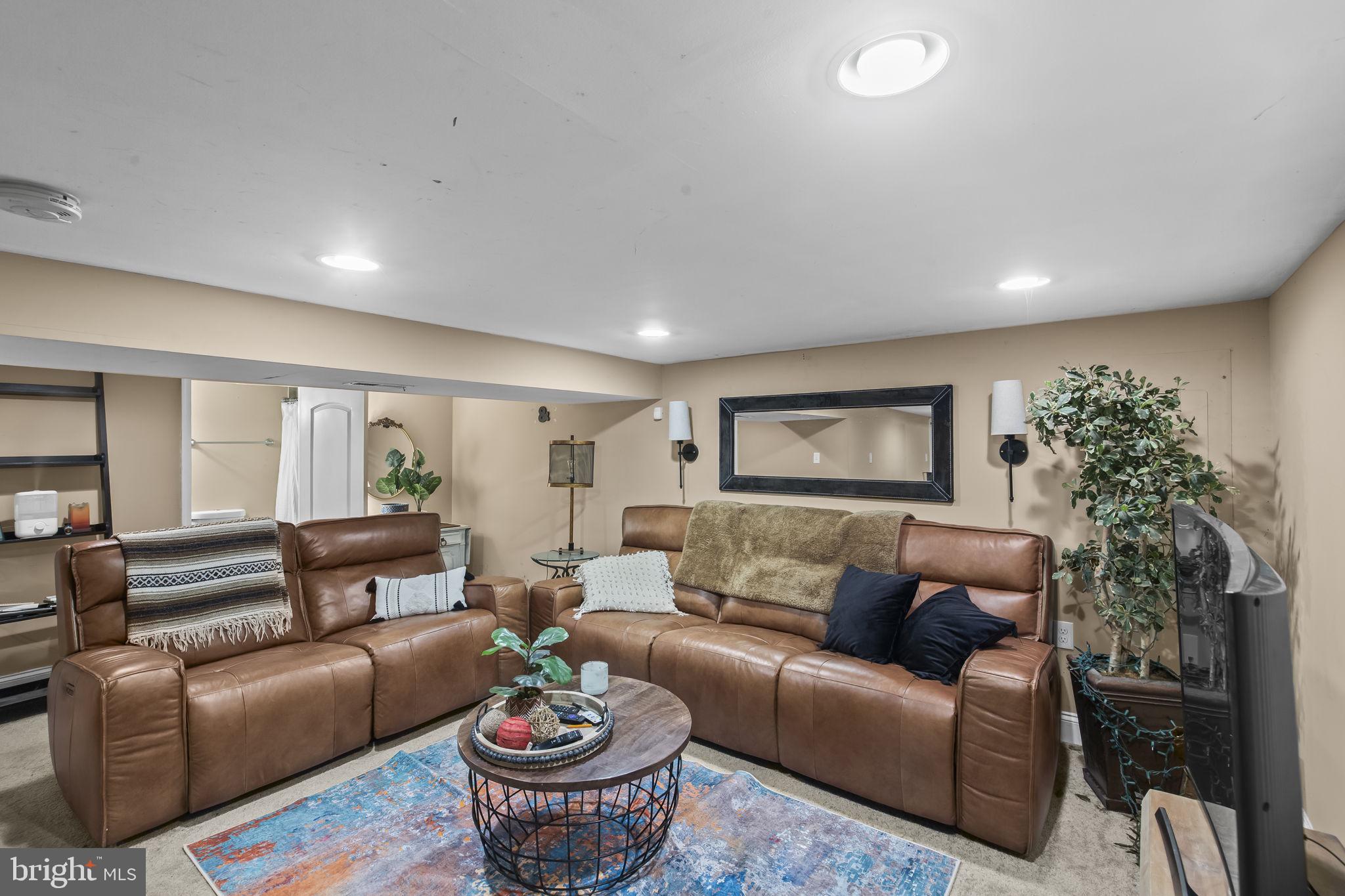 2600 Queen Anne Road Baltimore, MD 21216 - Photo 19 of 29 a living room with furniture and a wooden floor