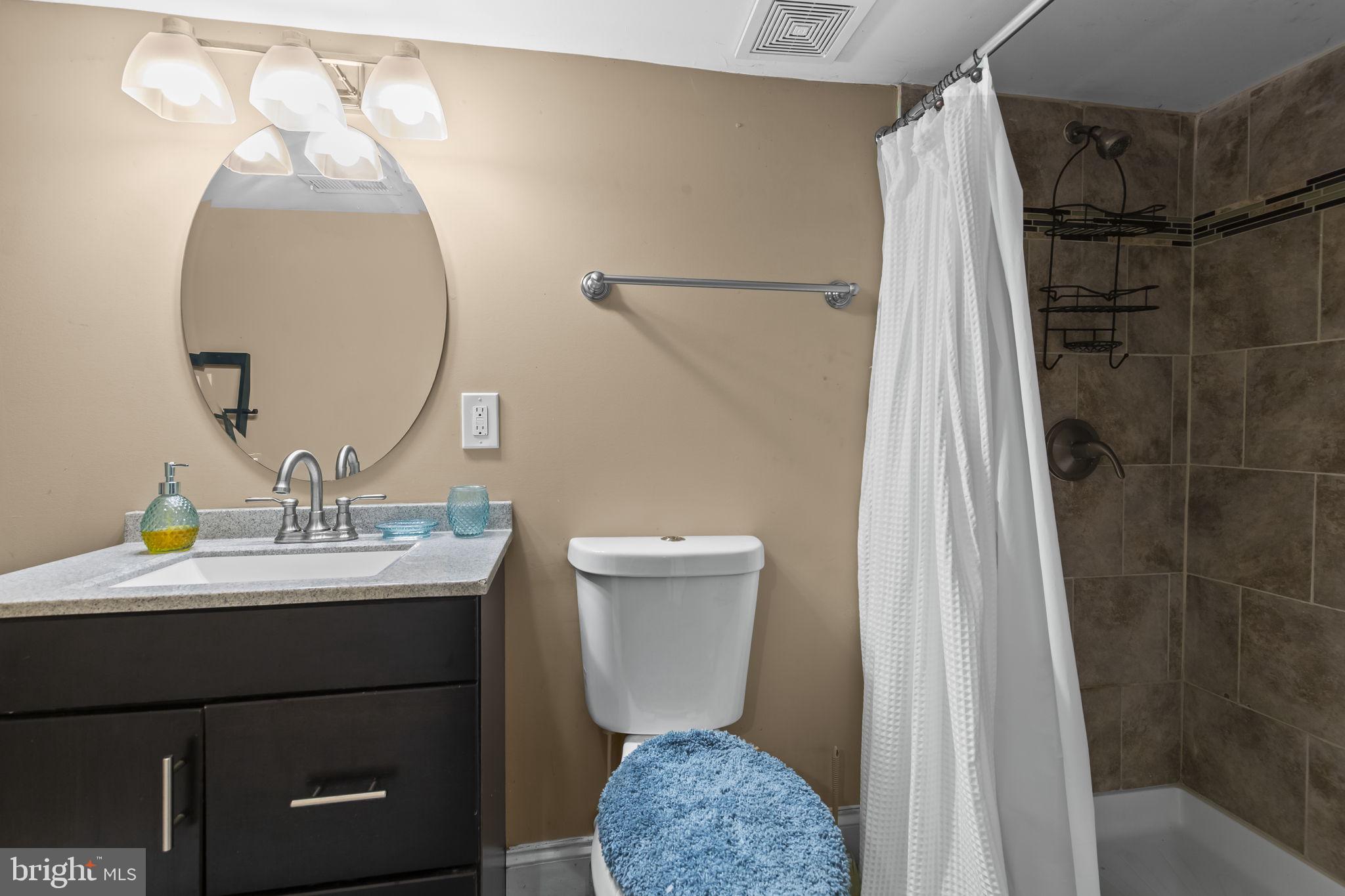 2600 Queen Anne Road Baltimore, MD 21216 - Photo 21 of 29 a bathroom with a sink toilet and shower